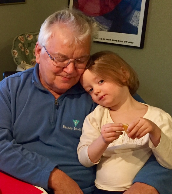 A tender moment after the tree has been decorated.