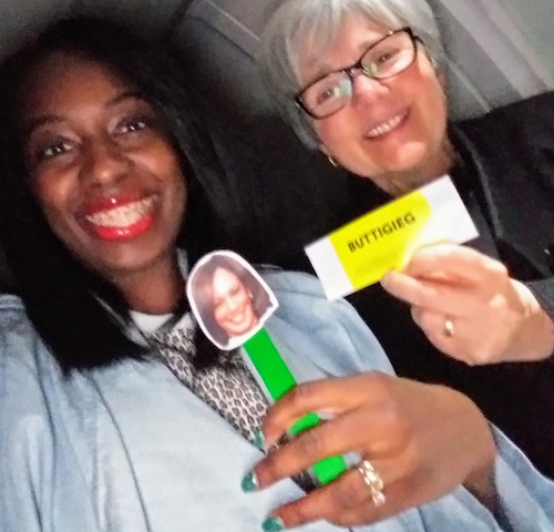 Attorney Stephanie Morales holds her Kamala swag while I brandish my LJC dinner ticket.