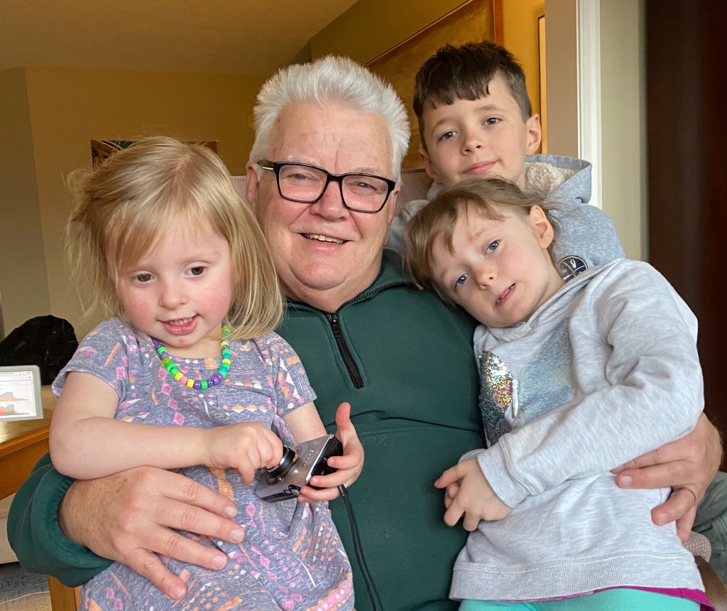 We used to get great cuddle pictures. Now it's really hard to get three kids to look up and smile for the camera.